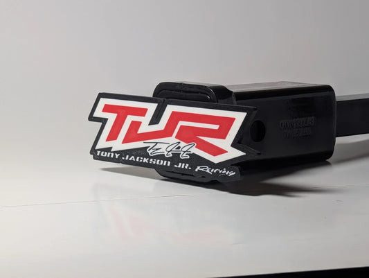 Custom red & white racing logo hitch cover shown in a receiver