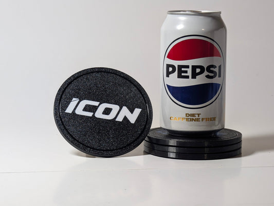 Round black custom coasters shown stacked beside a drink can