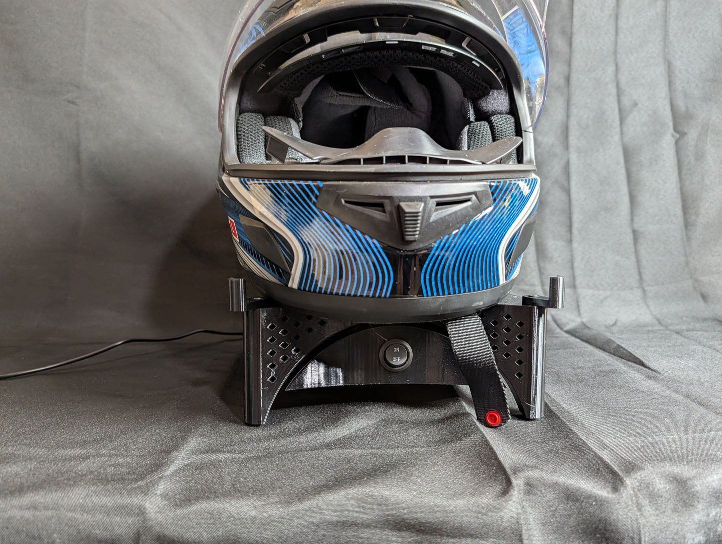 Front view of helmet on the Trackside AirFlow helmet dryer stand