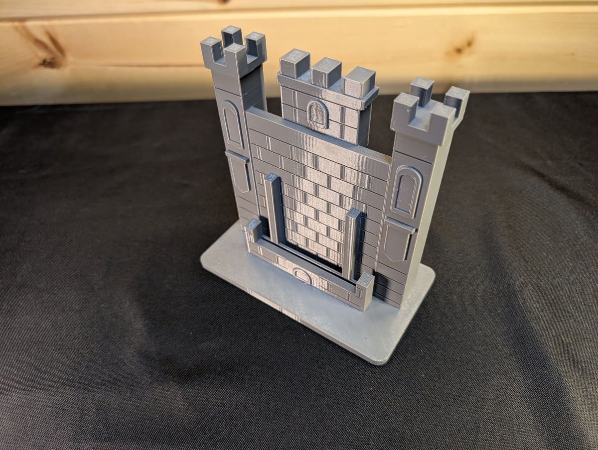 Actual tall castle card display from an angle showing brickwork and side towers