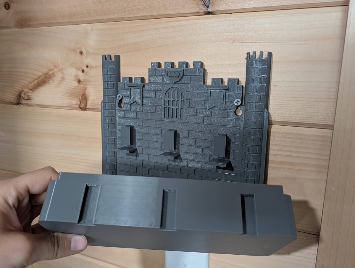 Actual castle wall organizer with the tray lifted off, showing the removable design