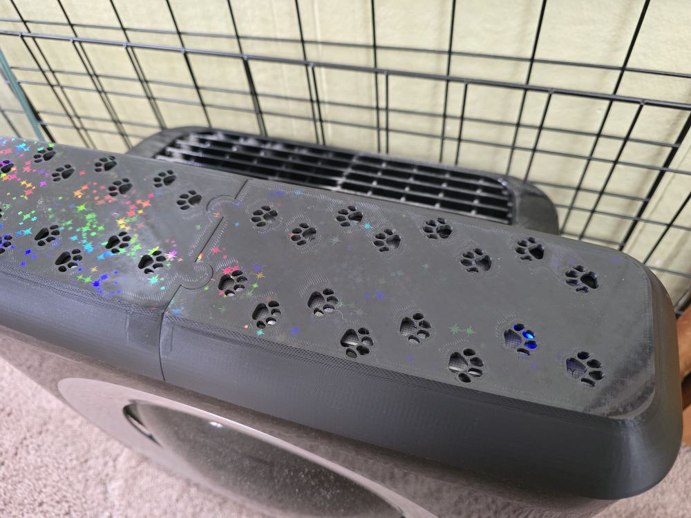 Installed cover with the purifier outlet grille visible behind it