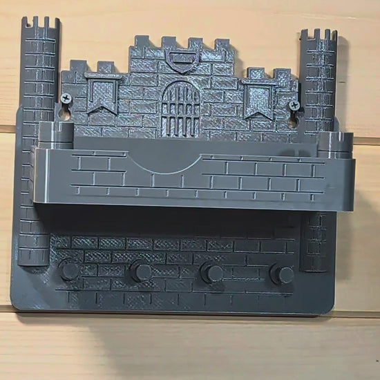 Actual castle wall organizer demonstration showing keys being hung on the lower pegs
