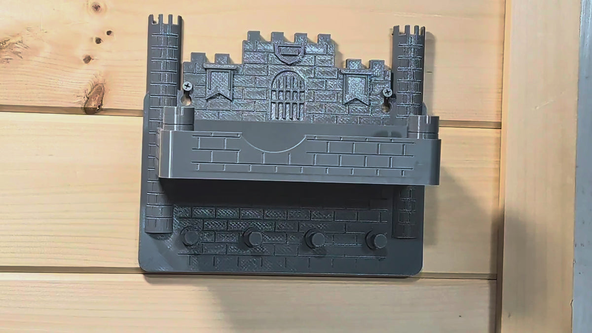Actual castle wall organizer demonstration showing keys being hung on the lower pegs