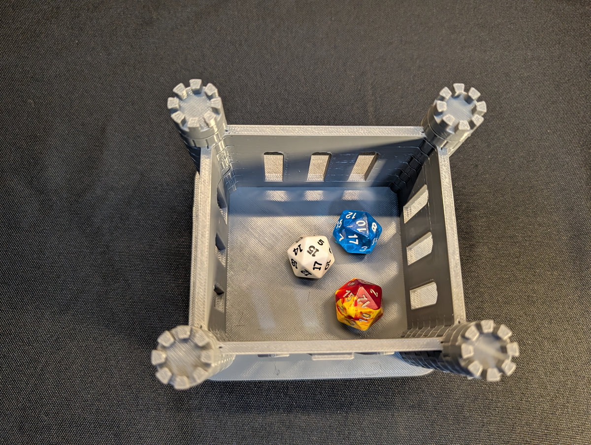 Open castle dice jail showing dice inside, dice not included